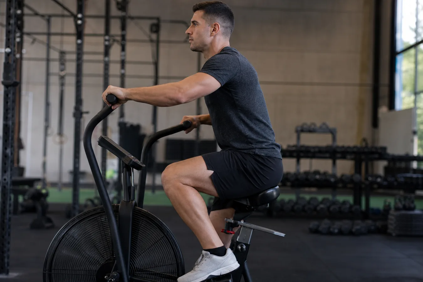 Athlete setting seat height and posture on an air bike