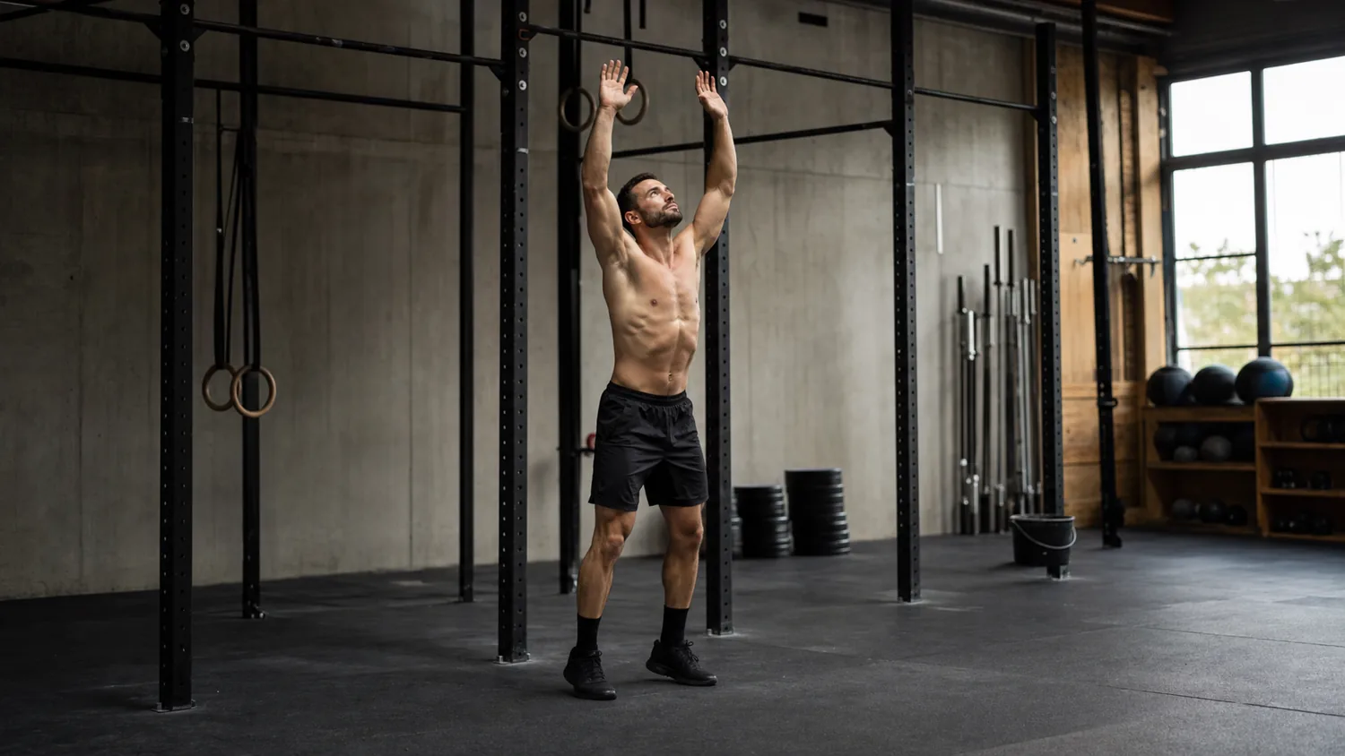 Athlete setting up under a pull-up bar for burpee pull-ups