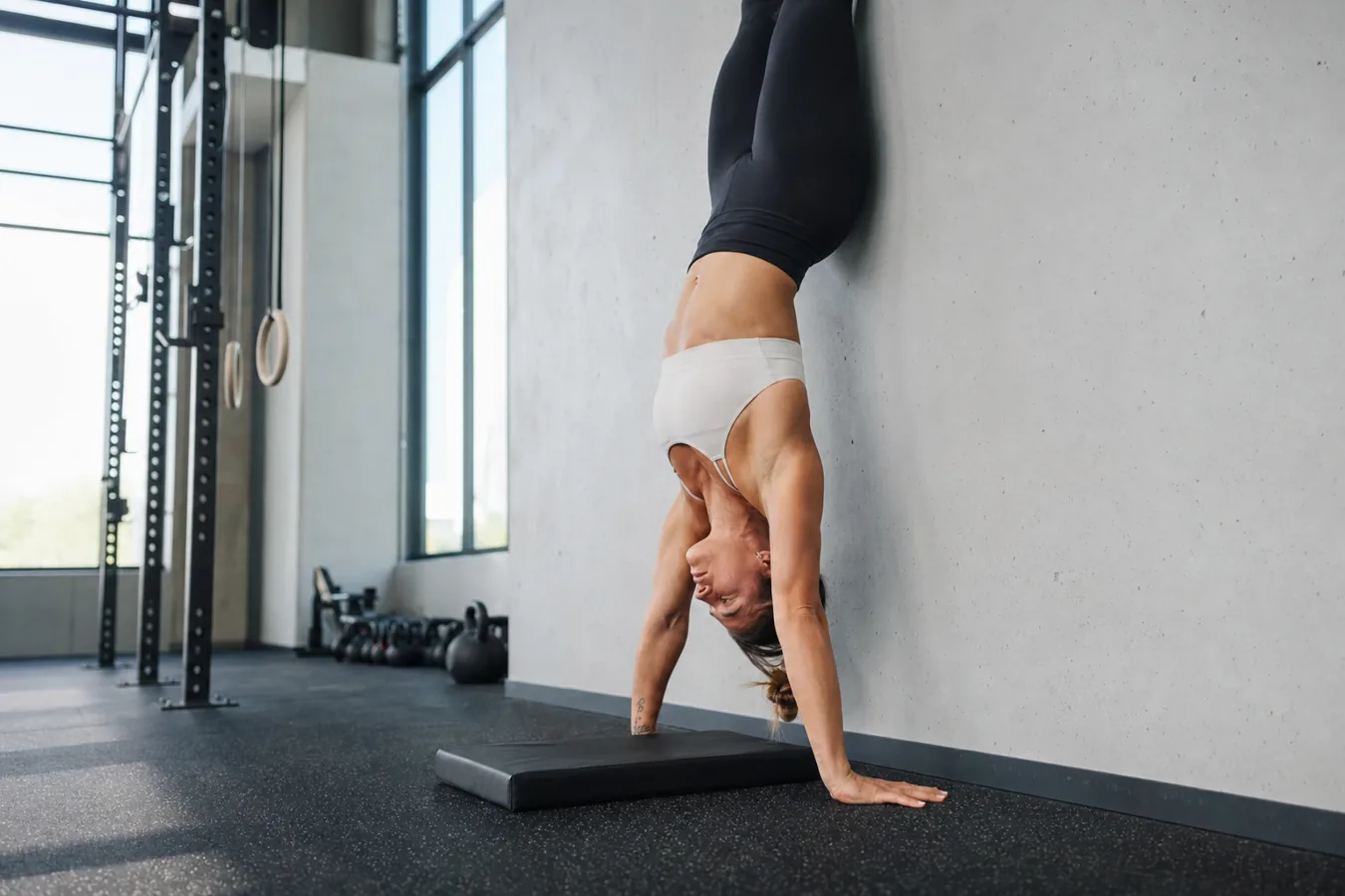 Athlete setting hand position for a CrossFit handstand push-up