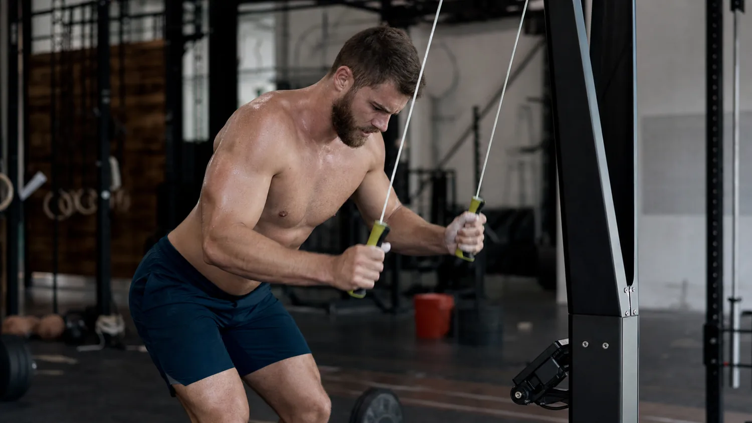 Athlete using a SkiErg in a CrossFit gym