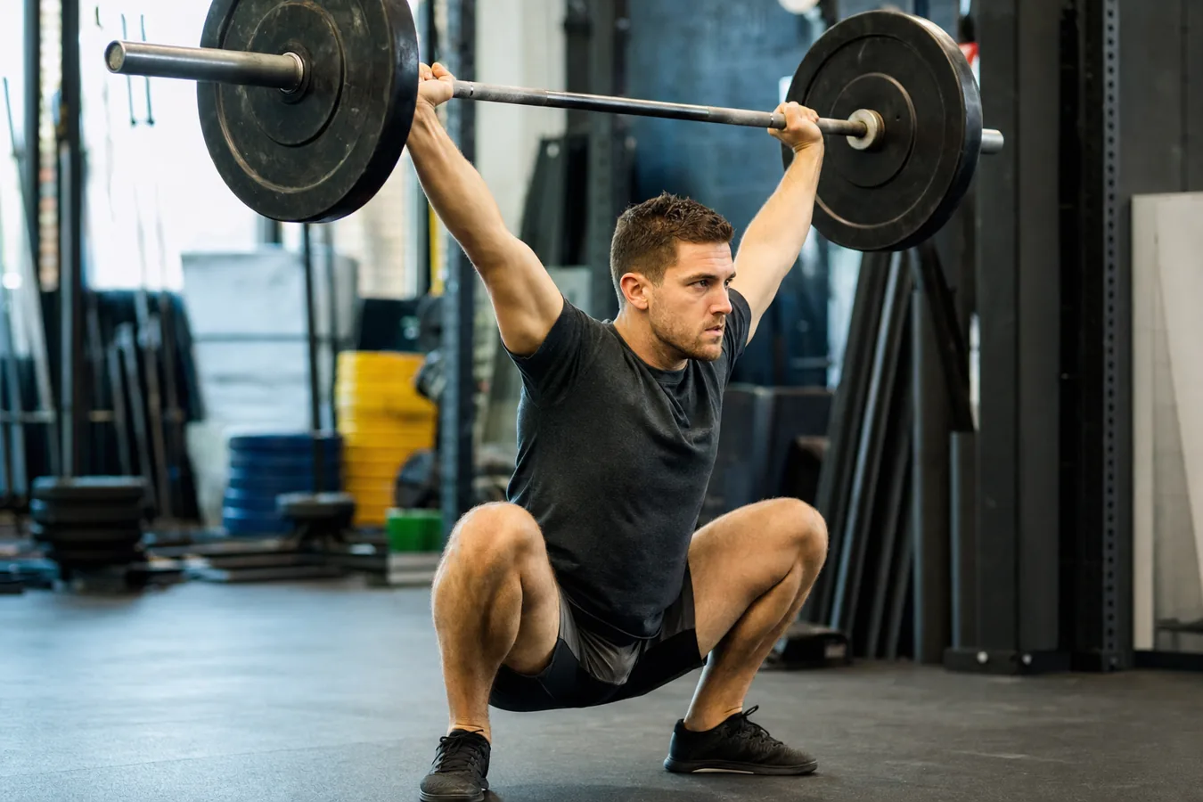 CrossFit athlete receiving a snatch balance with locked elbows and balanced feet