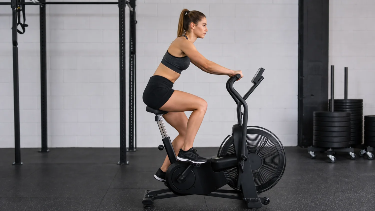 CrossFit athlete riding a BikeErg with a smooth controlled cadence